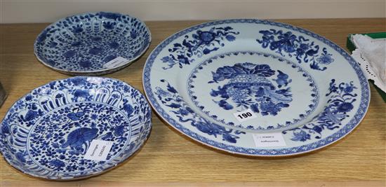 A pair of Chinese Kangxi blue and white floral dishes and a Qianlong blue and white dish, diameter 35cm
